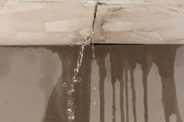Professional Flood Damage Cleanup technician working in Acushnet, MA